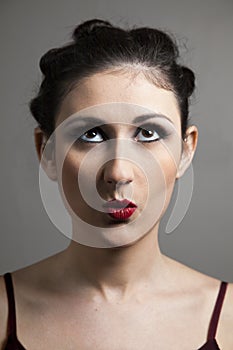 Portrait of young woman with red lips