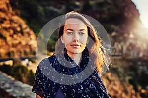 Portrait, young woman and relax outdoors or tourist for vacation in summer or europe fresh air in nature and on