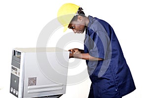 Portrait of a young woman repairing a computer.