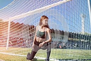 Portrait of a young woman resting after exercising  or run on stadium. Fitness and healthy lifestyle concept