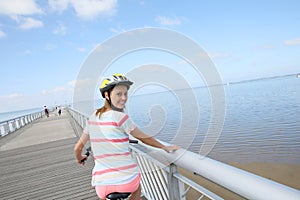 Portrait of young woman riding bike