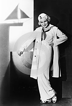 Portrait of a young woman in sailors hat and outfit photo