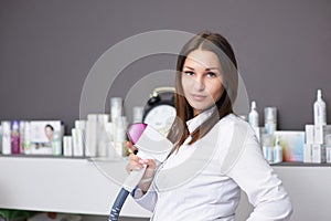 Portrait of a young woman in a salon.