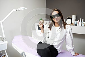 Portrait of a young woman in a salon.