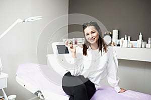 Portrait of a young woman in a salon.