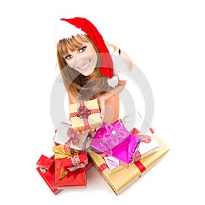 Portrait of young, woman Santa with gift boxes