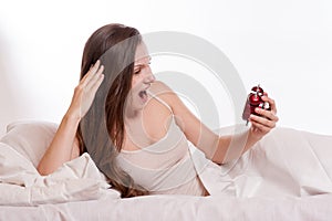 Portrait Of Young Woman Screaming To The Alarm