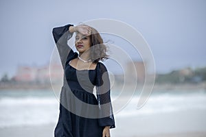 Portrait of young woman seen outdoors