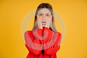 Portrait of a young woman with shocked expression.