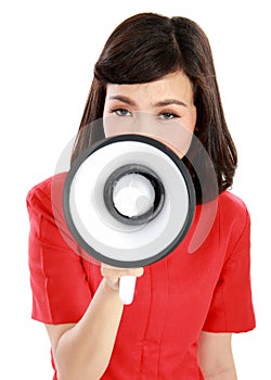 Portrait of a young woman shouting with a megaphone