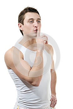 Portrait of young woman with silence sign isolated