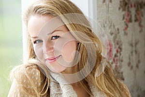 Portrait of a young woman sitting indoors