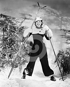 Portrait of a young woman skiing and smiling photo