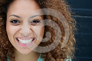 Portrait of a young woman smiling with happy expression on face