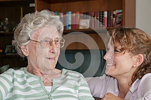 Portrait of young woman smiling at her grandmother