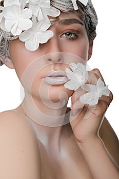 Portrait of a young woman with a snow make-up