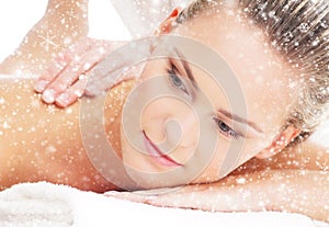 Portrait of a young woman on a spa massage on the snow
