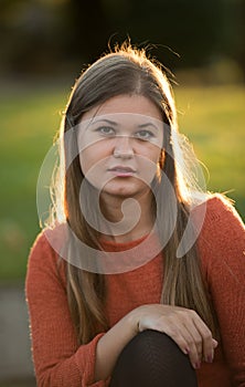 Portrait of young woman in sun light