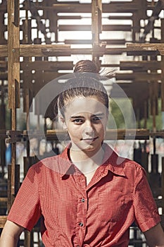 Portrait of a young woman with topknot