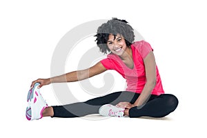 Portrait of young woman touching toes while exercising