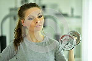 Portrait of young woman training in gym