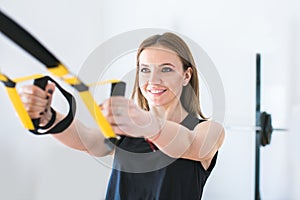 portrait of young woman training at the gym