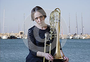 Portrait of a young woman trombonist