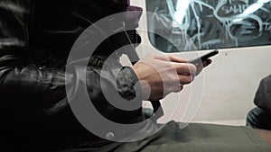 Portrait of a Young Woman Typing Message On Mobile Phone In Subway Train, Brunette Woman With Smartphone