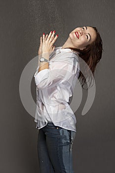 Portrait of a young woman under the spray