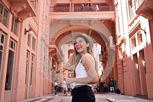 Portrait of young woman visiting the historic palace Casa de Cultura Mario Quintana in Porto Alegre, Brazil