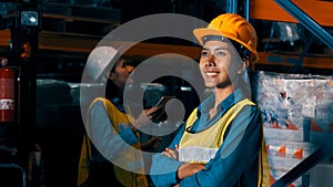 Portrait of young woman warehouse worker smiling in the storehouse