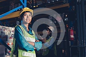 Portrait of young woman warehouse worker smiling in the storehouse