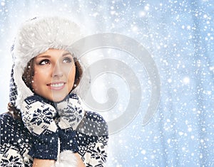 Portrait of a young woman in warm winter clothes photo