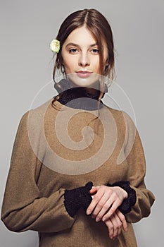 Portrait of a young woman in warm wool sweater. Clean pretty face with natural makeup