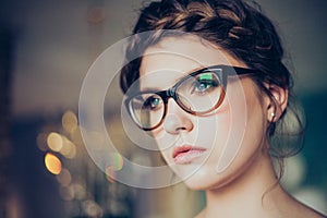 Portrait of young woman wearing glasses