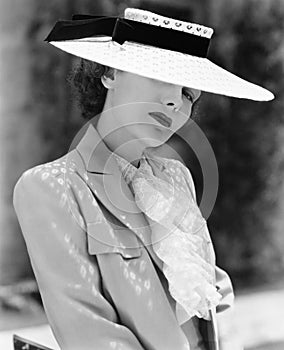 Portrait of a young woman wearing a hat photo