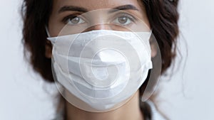 Portrait of young woman wearing medical protective mask