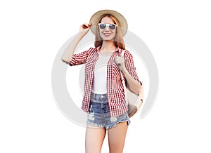 Portrait of young woman wearing summer straw hat, checkered shirt, shorts isolated on white background