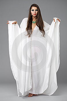 Portrait of the young woman in a white tunic Arabic