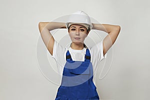 Portrait of young woman worker standing on white background