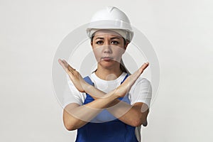 Portrait of young woman worker standing on white background