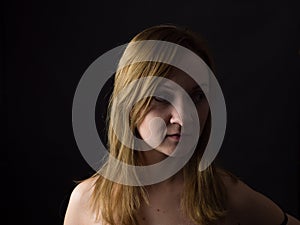 Portrait of young woman on yelllow cole field background