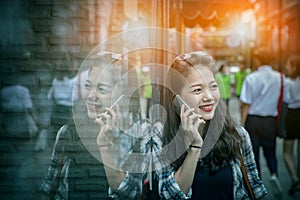 Portrait of younger asian woman talking to smart phone toothy sm