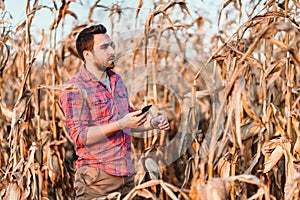 portraits - active farmer using technology, mobile phone in everyday life