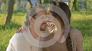 Portraits of beautiful couple kissing in the park