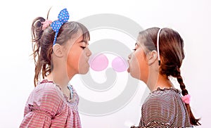 Portraits of beautiful little girls blowing bubbles