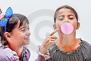 Portraits of beautiful little girls blowing bubbles