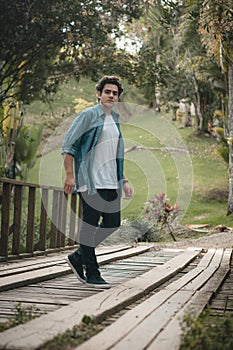 Portraits of boy walking on a bridge photo