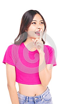 Portraits of young Asian women.Finger covering his mouth, signaling that no sound. With a smiling face happily, a beautiful woman