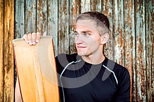 Portrat of young canoeist holding paddle. Concept of canoeing as dynamic and adventurous sport. photo